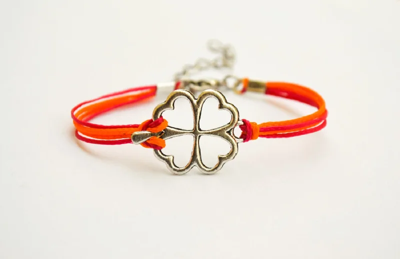 Ladies bracelets with den charms -Clover bracelet, orange and pink cord bracelet with a silver shamrock charm, children's size