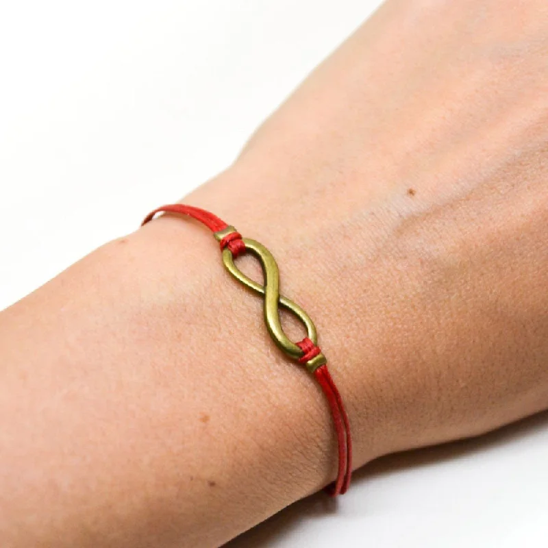 Ladies bracelets with grace charms -Red cord bracelet with a bronze endless infinity charm, yoga jewelry