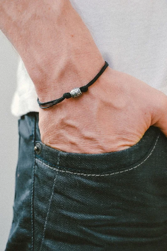 Ladies bracelets slim flair -Men's bracelet with a silver aztec tribal bead and a black cord