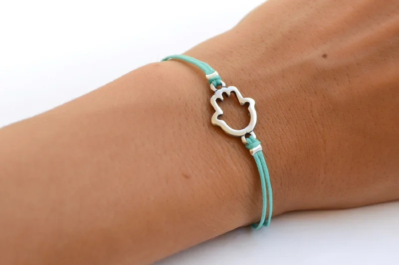 Ladies bracelets artsy flair -Turquoise cord bracelet with a silver Hamsa charm, evil eye protection