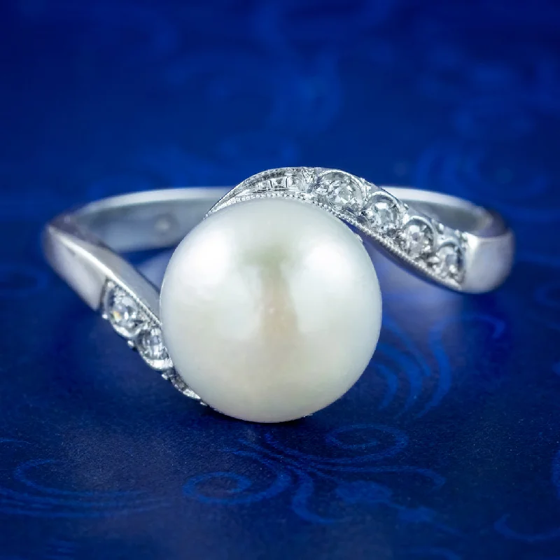 ladies-radiant-cut-diamond-rings-Vintage Pearl Diamond Solitaire Twist Ring