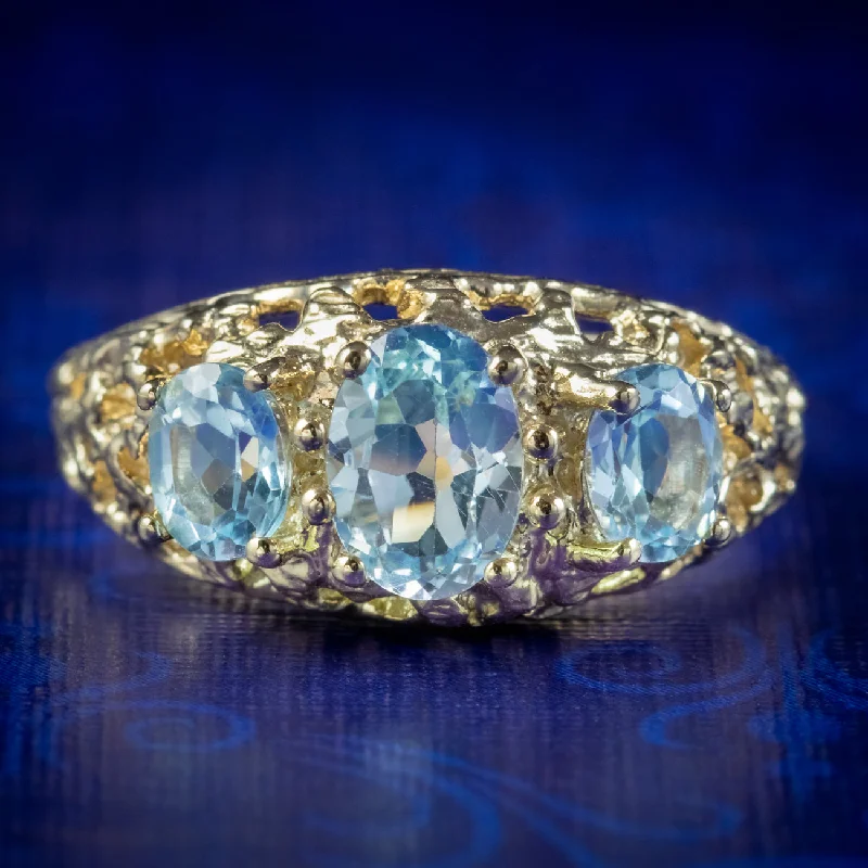 ladies-radiant-cut-rose-gold-rings-Victorian Style Blue Topaz Trilogy Ring 9ct Gold