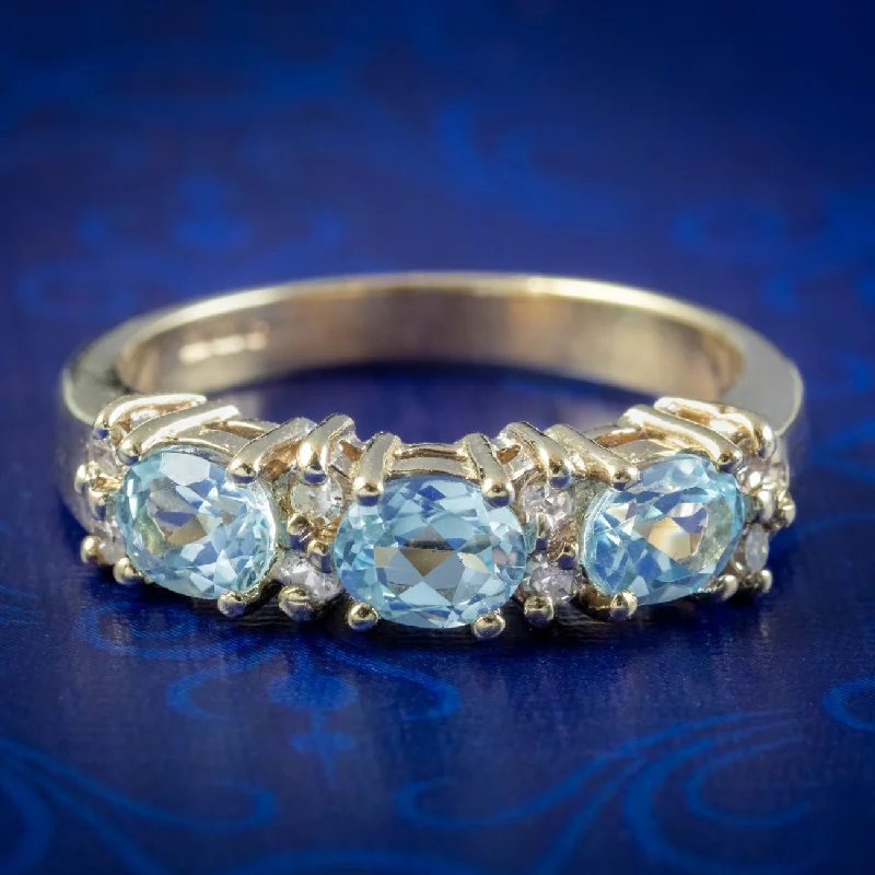 ladies-ruby-promise-rings-Victorian Style Blue Topaz Diamond Trilogy Ring 9ct Gold