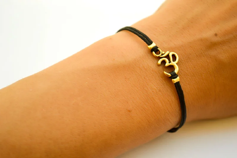 Ladies bracelets with reef charms -Black cord bracelet with gold tone Om charm, adjustable bracelet for her